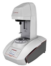 Mettler Toledo analytical instrument with a digital display and upper measurement head, used for material characterization in a laboratory