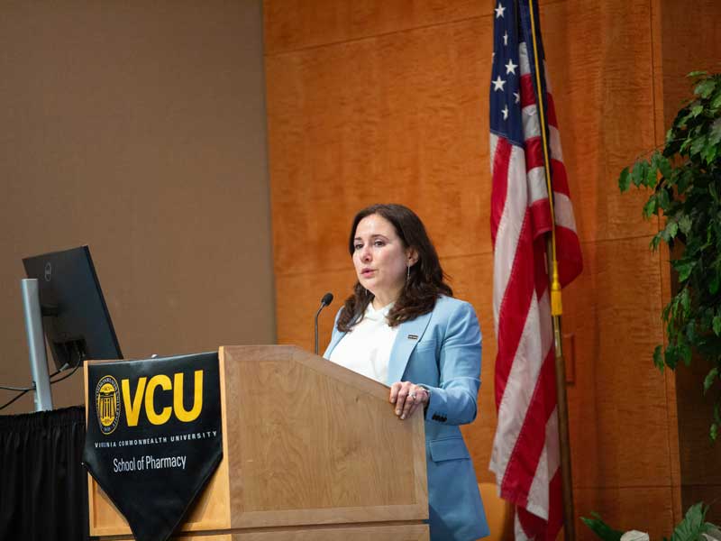 Keynote speaker Anna Prilutsky addresses the audience in the Library of Virginia auditorium at the 3rd Annual School of Pharmacy Convocation.