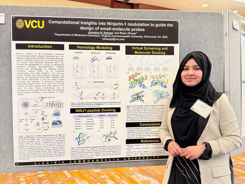 Jannatun Namme stands next to a research poster she shared during VCU Research Day