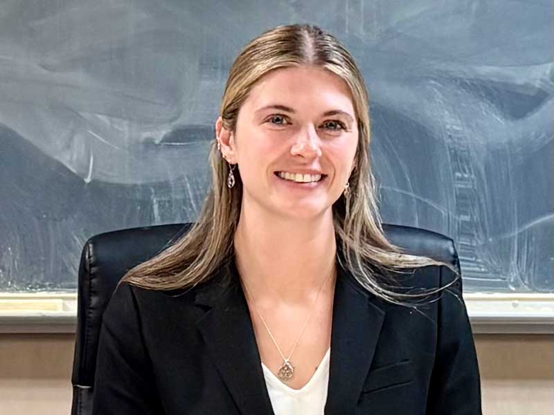 Ally Thompson smiles for a photo after her dissertation defense.